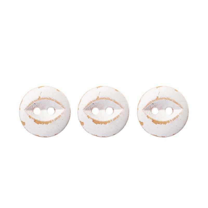 Three round white fish-eye buttons with two holes each