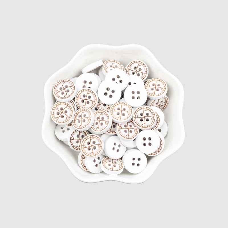 Assorted round 4-hole painted wood buttons in tray, white with brown stitch-style pattern
