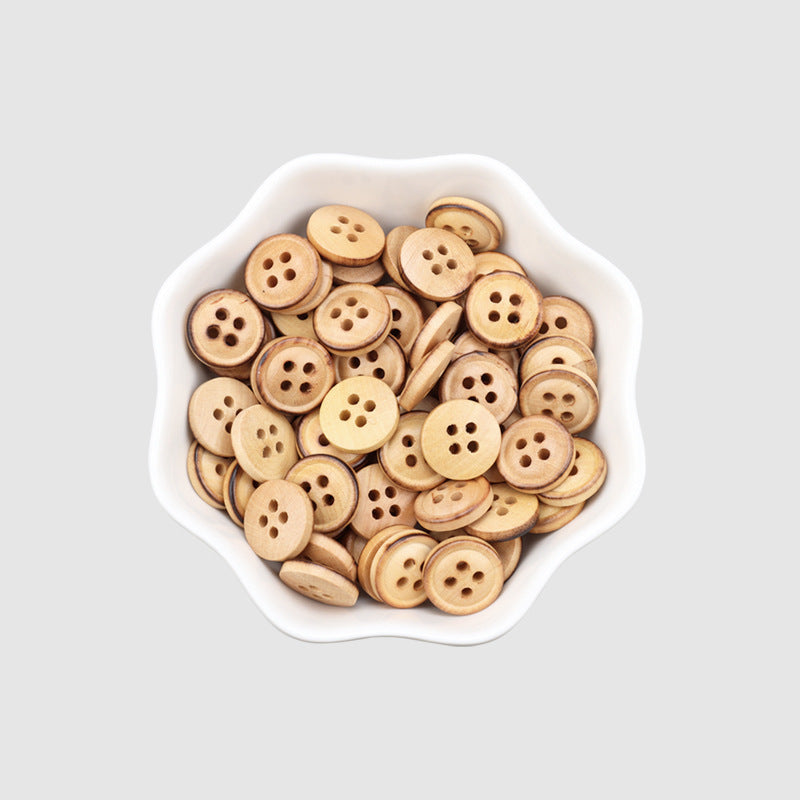 Assorted 60pcs 11.5mm poplar wood four-hole buttons in a dish, fire-burned edges