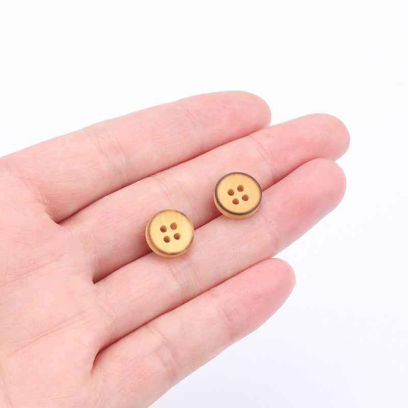 Two round 4-hole poplar wood buttons on hand, light brown, 11.5mm