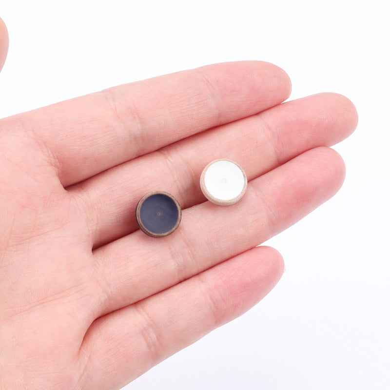 Round wood buttons in hand: white and blue 11.5mm with distressed finish