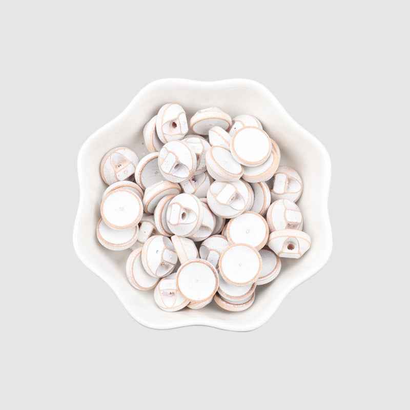 Pile of 11.5mm round wood buttons, white, distressed painted edges