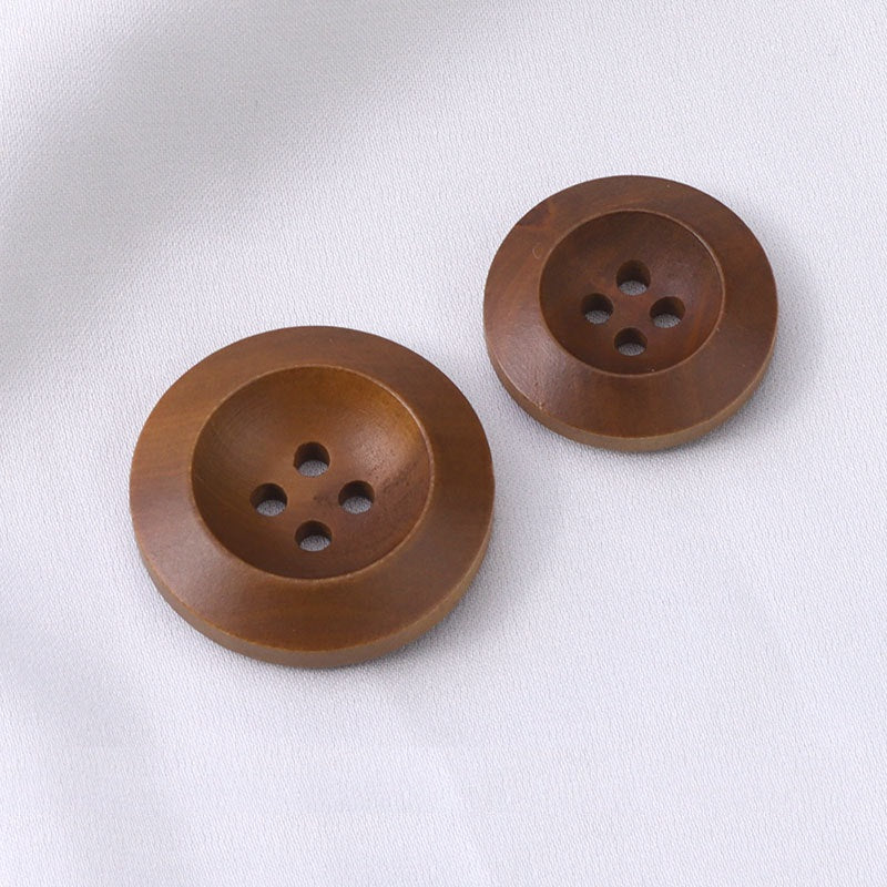 Pair of round wood buttons, light coffee brown, 4-hole faces