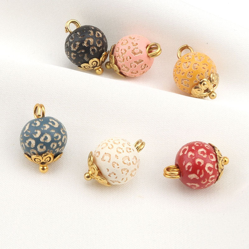 10mm metal flower bead buttons with leopard prints in black, pink, and orange, gold trim