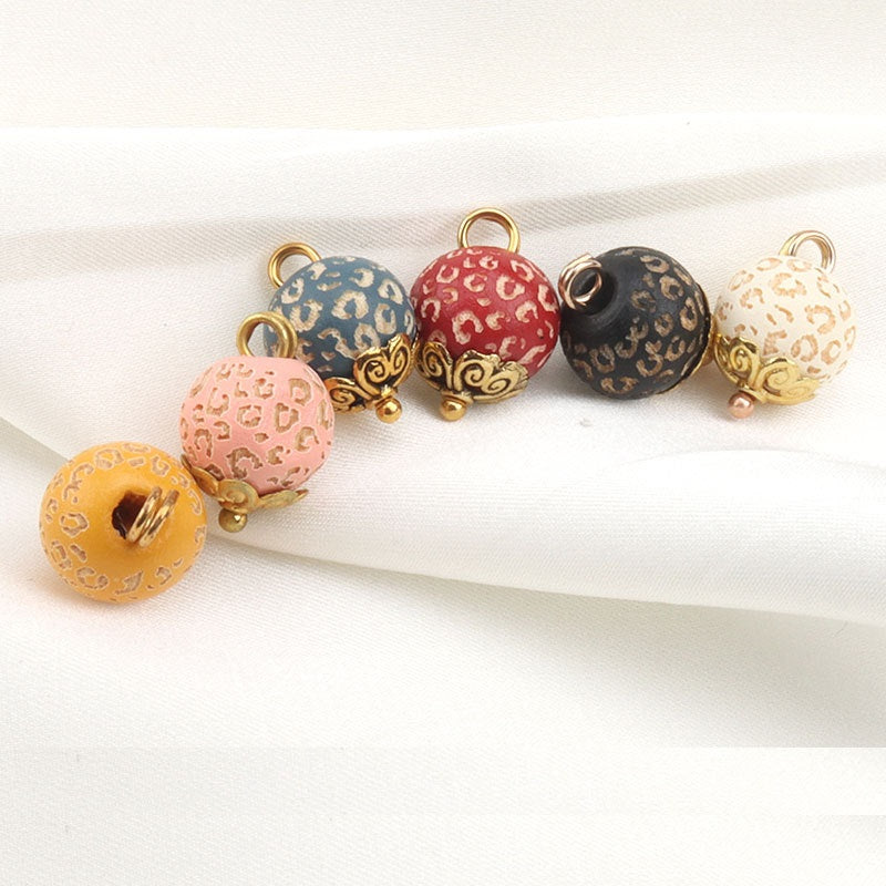 10mm metal flower bead buttons set with leopard prints in blue, red, cream, and gold accents