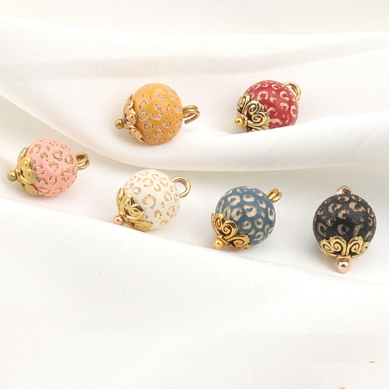 10mm metal flower bead buttons in assorted leopard prints: yellow, pink, blue, and black