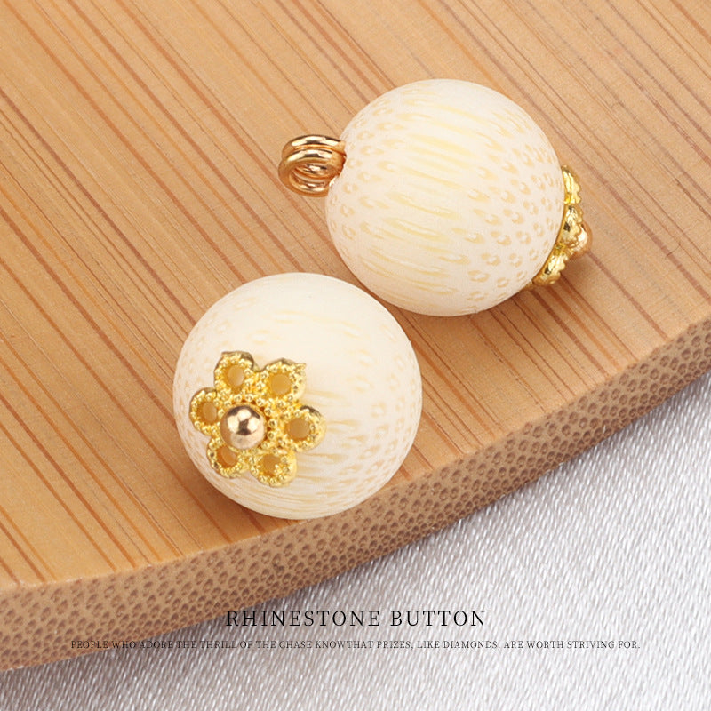 Cream bamboo frog knot button pair: round with gold flower gem and curved back ring