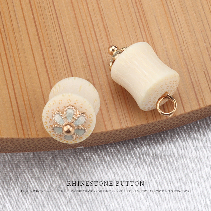 Cream bamboo frog knot buttons: round face with light teal flower stones and curved back with ring