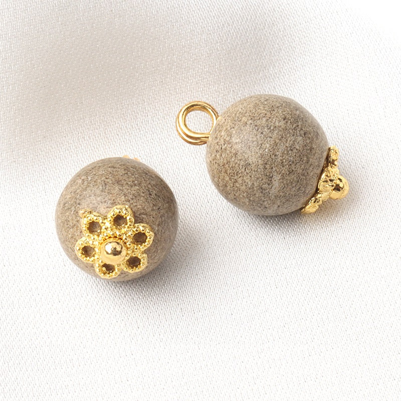 Set of khaki round coconut shell buttons with gold flower centers and metal shank