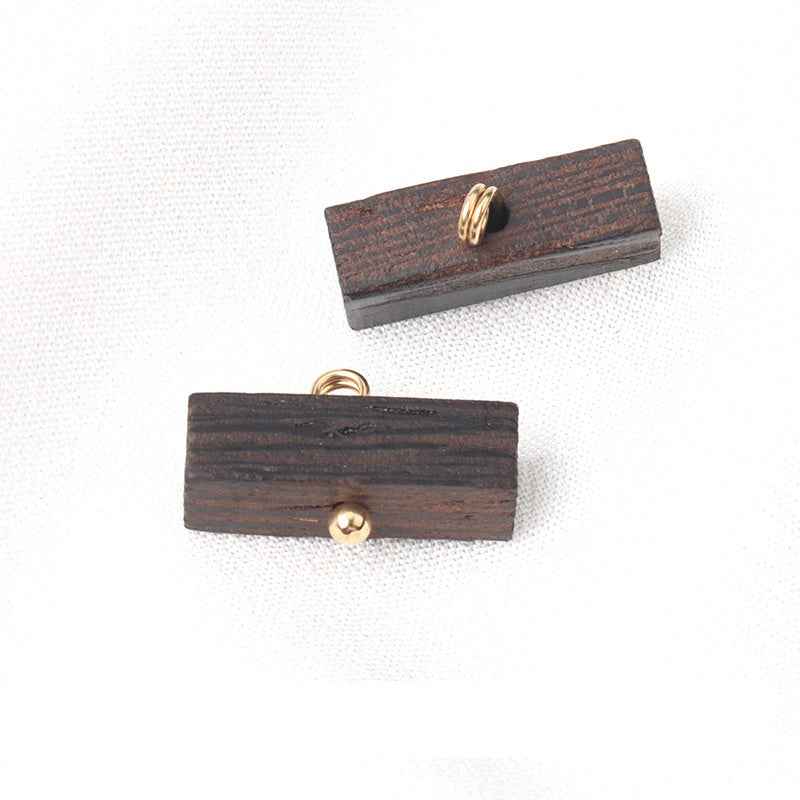 Two dark brown long strip wood buttons with gold loop backs