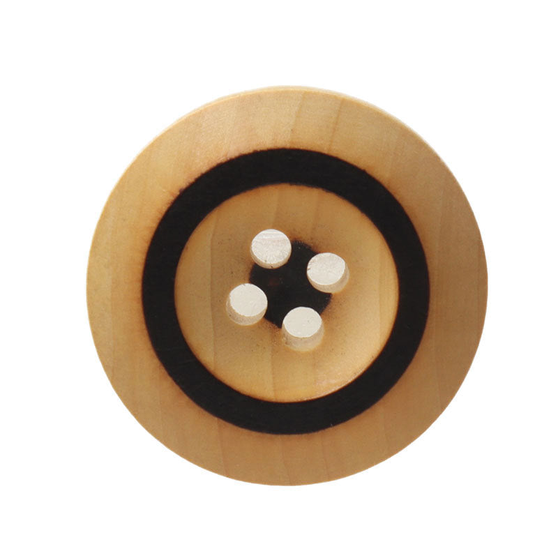 Round light wood button with black laser-burned ring and four holes