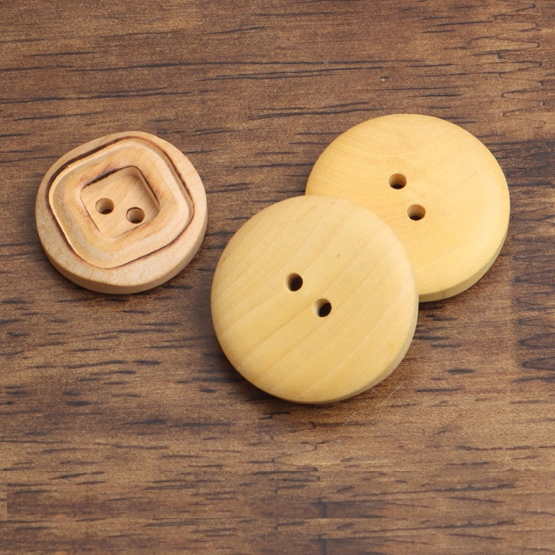 Set of round 2-hole wood buttons, light tan, square interior backs