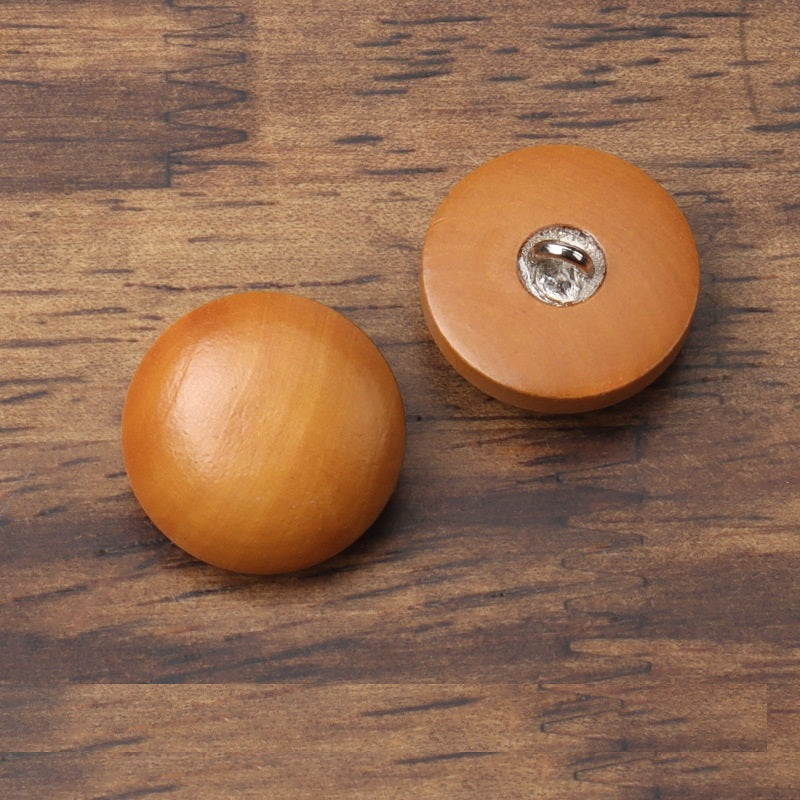 Round brown wooden coat button pair, metal shank tops visible