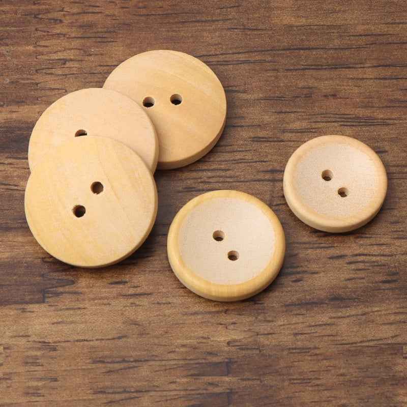Set of light tan two-hole wood buttons, round with raised edge and visible holes.
