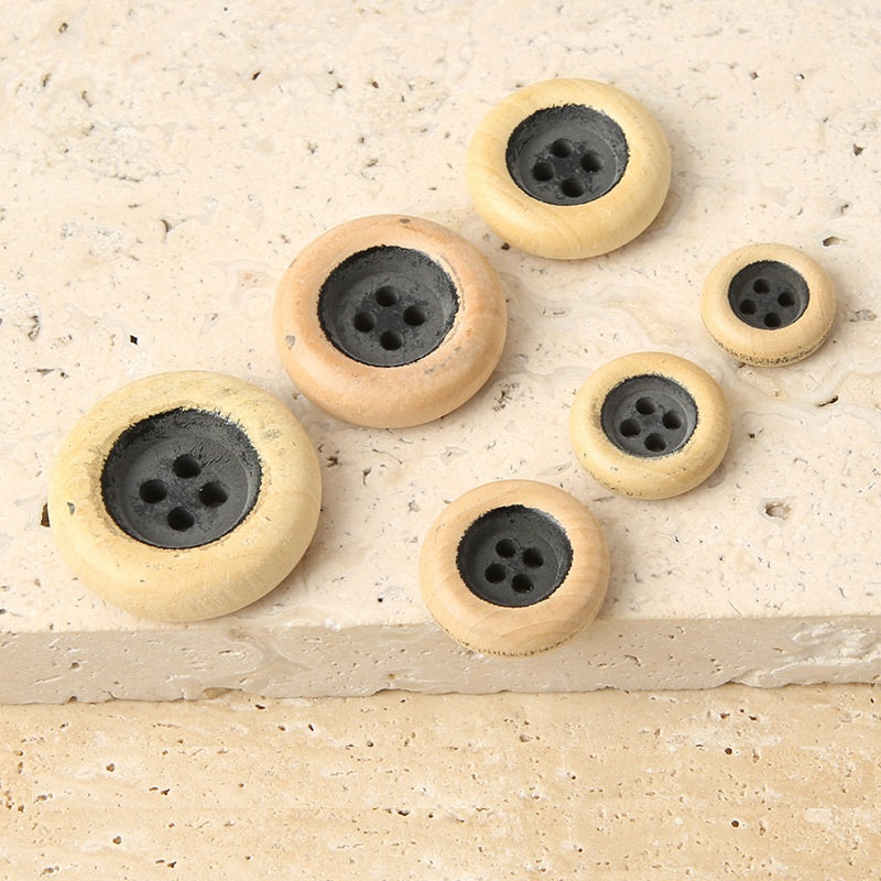 Assorted round 4-hole wooden buttons, light tan, dark gray painted distressed centers