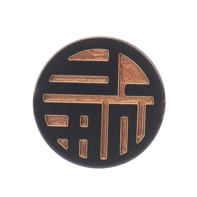 Round horn button with laser-engraved Chinese character, dark horn and gold trim
