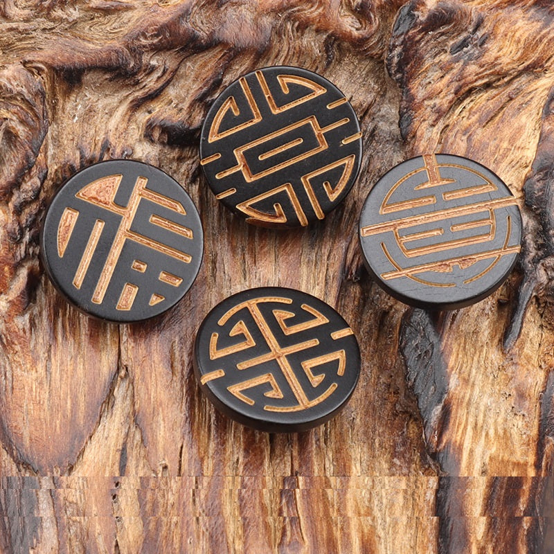 Set of round horn buttons with laser-engraved Chinese characters, gold on dark