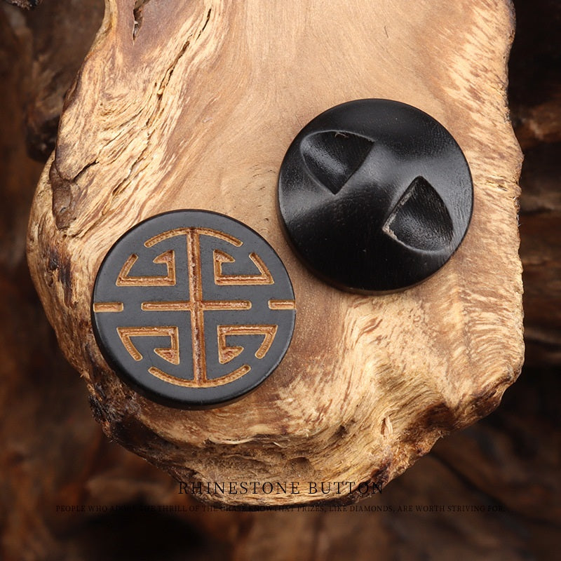 Round horn button front with Chinese character engraving in gold, dark horn back