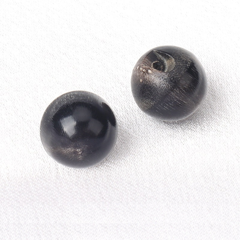 Natural buffalo horn button, concealed hole, 10/11mm in dark black tone—2 shown