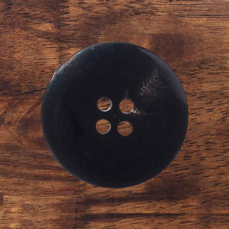 Black buffalo horn button, matte finish, 4 stitch holes, round design