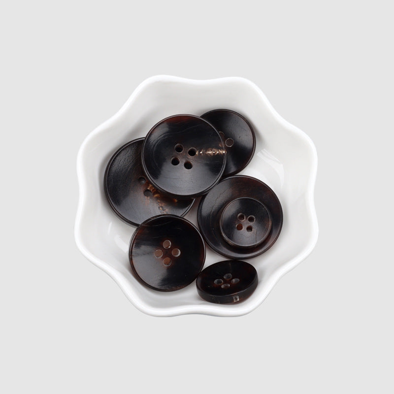 Assorted round horn buttons, dark color, each with 4 holes