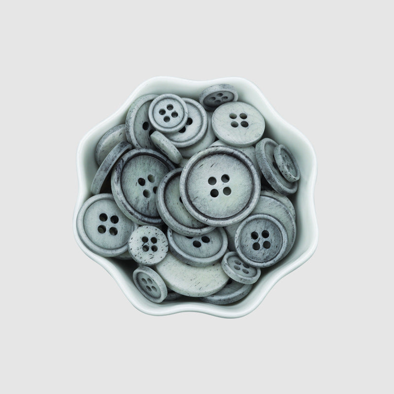 Gray 4-hole buttons assortment in a tray, vintage natural bone style for coats
