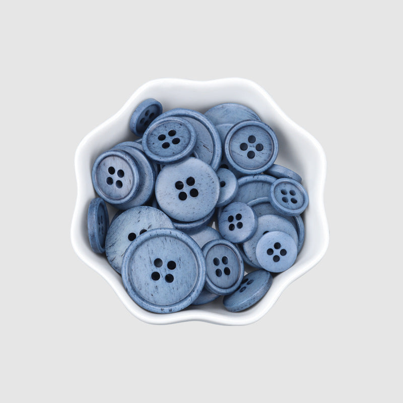 Blue 4-hole buttons in a tray, vintage natural bone style for sweaters and coats