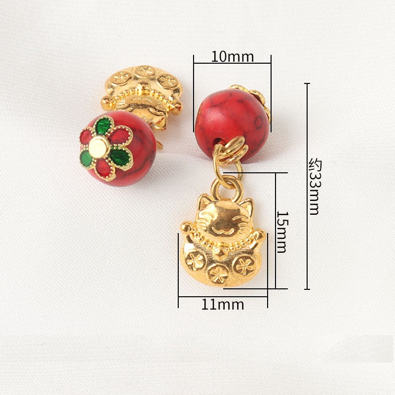 Chinese frog-knot pendant button with red bead and gold loop detail
