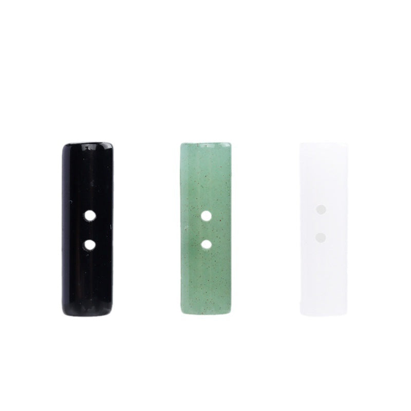 Cylindrical two-hole buttons, 25mm: light green, white, and black (4 pcs)