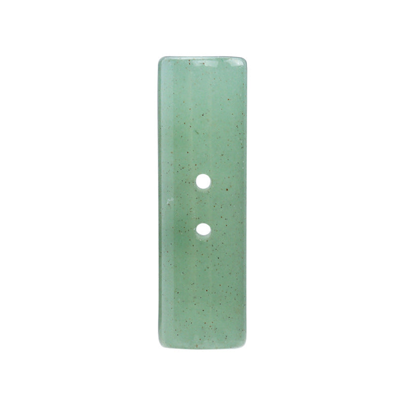 25mm light green cylindrical two-hole button, single close-up with two holes