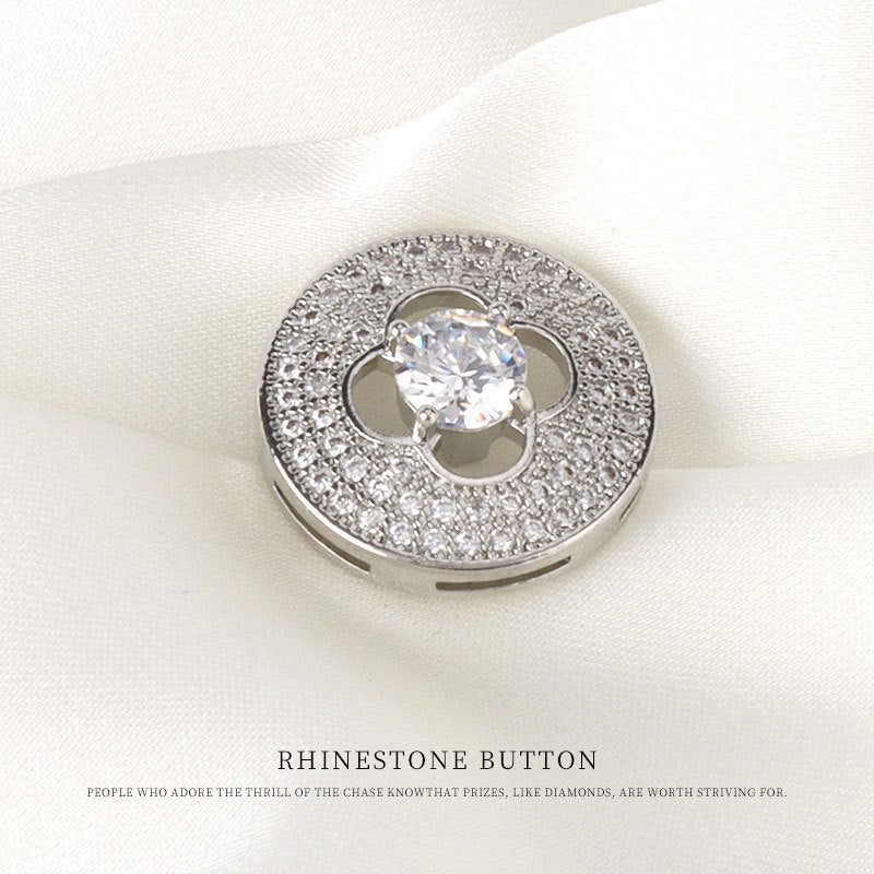 Silver-tone rhinestone button with four-leaf clover cutout and clear center stone