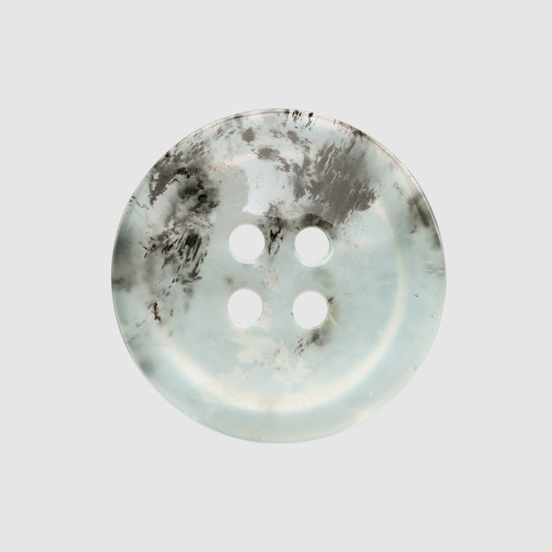 Light blue four-hole button with dark marbling, 18/25mm, round resin-style face