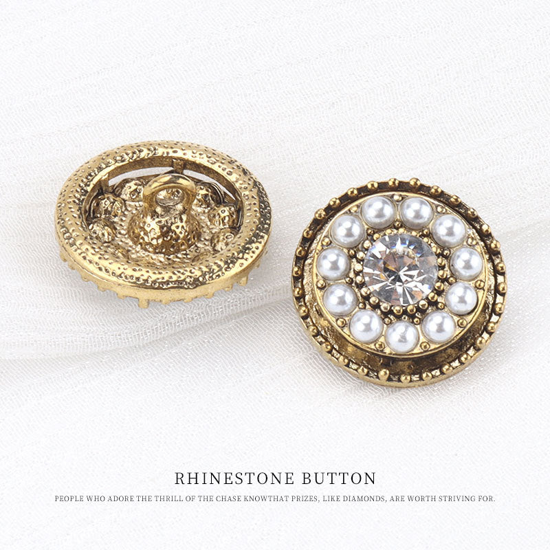 Gold rhinestone button: front with faux pearls and clear center; back visible