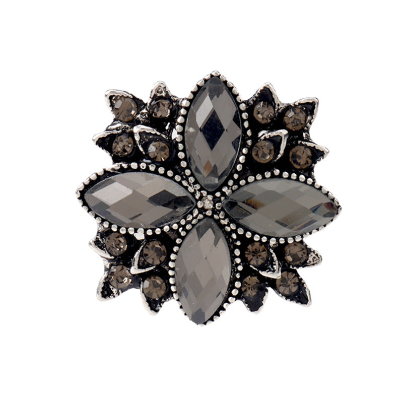 23mm gunmetal-black floral rhinestone shank button with faceted center and bead trim