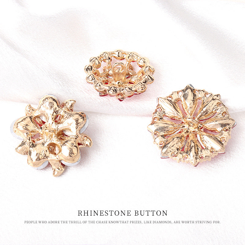 Gold-tone rhinestone button backs with ornate floral filigree settings