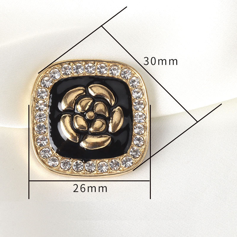 Black enamel flower square button with gold-tone edge and clear rhinestones—26mm size