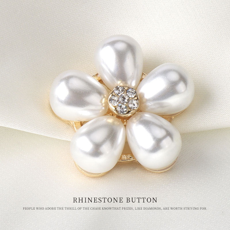Pearl flower rhinestone button with gold-tone prongs, white pearl petals, round crystal