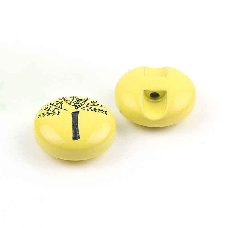 Yellow animal cartoon button pair: front illustration and back with sew-through hole