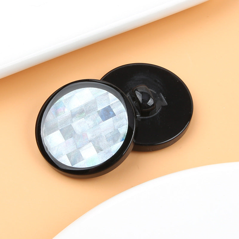 Black mosaic round resin shank button with iridescent mosaic front and visible shank