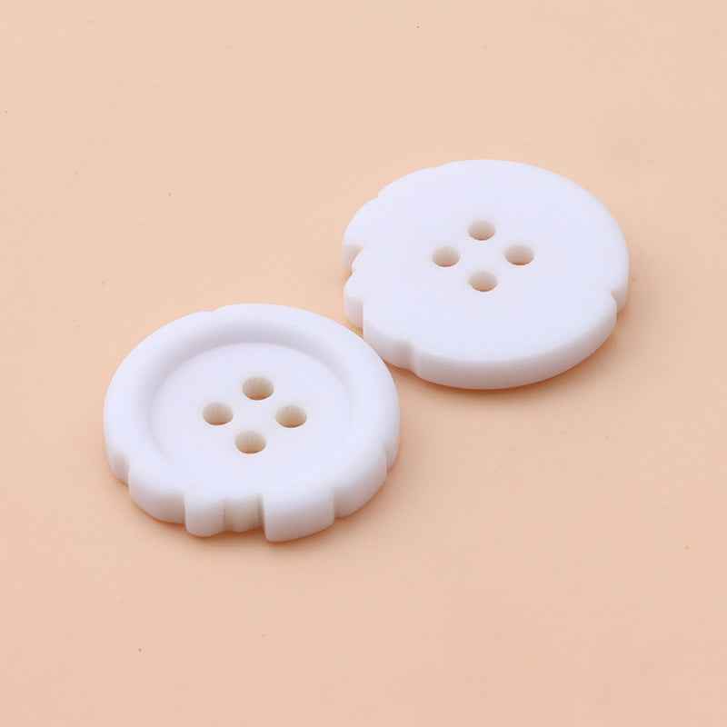 White 4-hole resin buttons, round scalloped edge, two pieces front