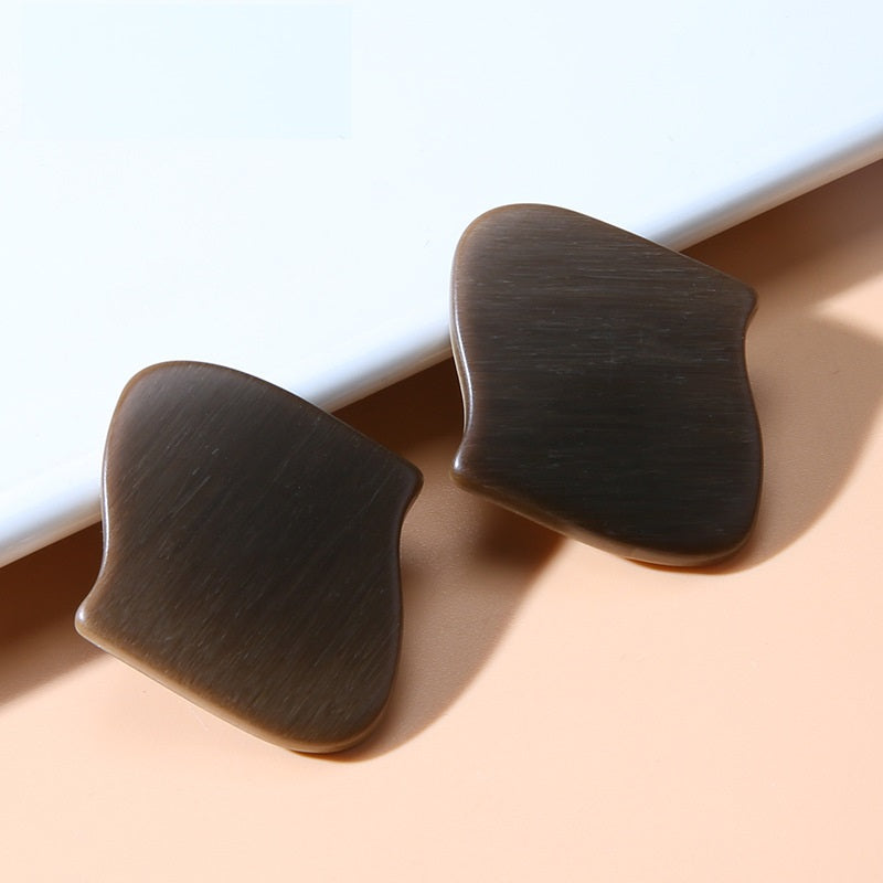 Dark coffee-brown irregular resin buttons with shanks, curved irregular shape, two pieces