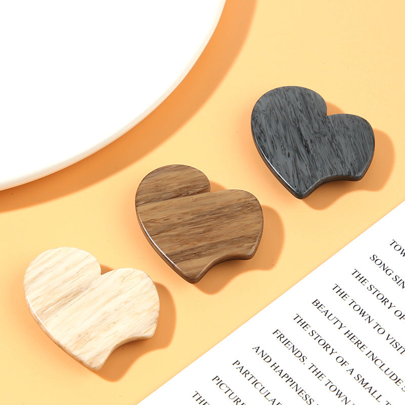 Heart-shaped resin shank buttons in beige, coffee, and gray, wood-grain finish