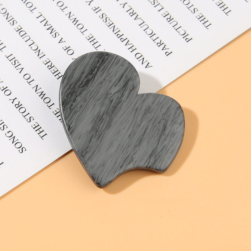 Gray heart-shaped resin shank button with wood-grain texture