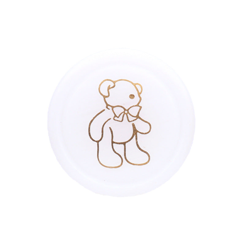 Round resin shank button, white with teddy bear line drawing