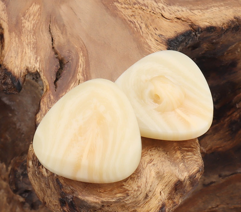 Beige rounded-triangle resin buttons with center shank holes, jacket button set