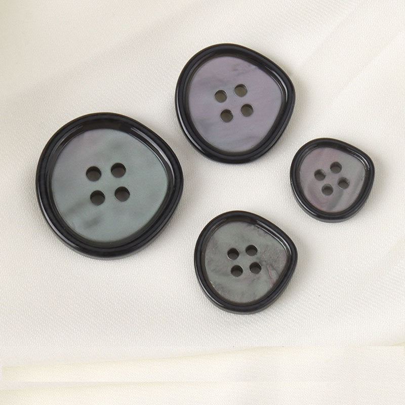17.5-30mm waterdrop resin jacket buttons with four holes, dark outlines on gray tones