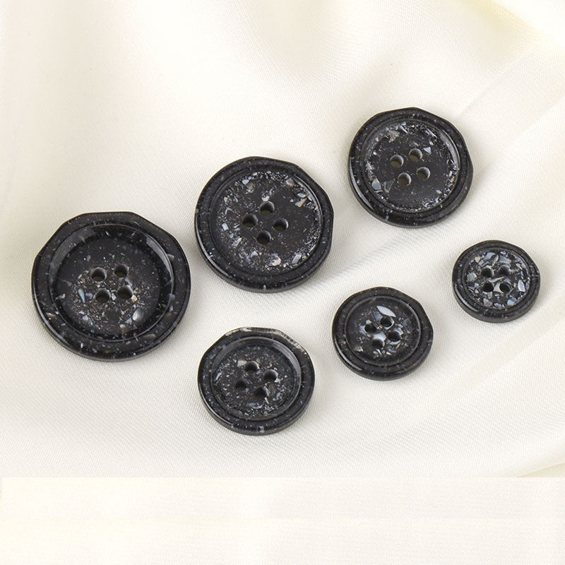 Set of black four-hole resin rock buttons, round, each with four holes