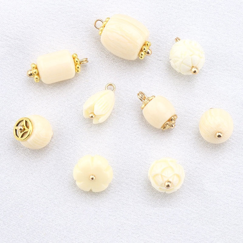Beige resin frog buttons set with gold studs and loops, multiple styles shown
