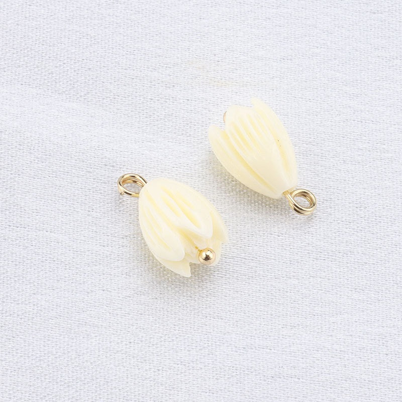 Beige floral-style resin frog buttons with gold loop and small gold stud