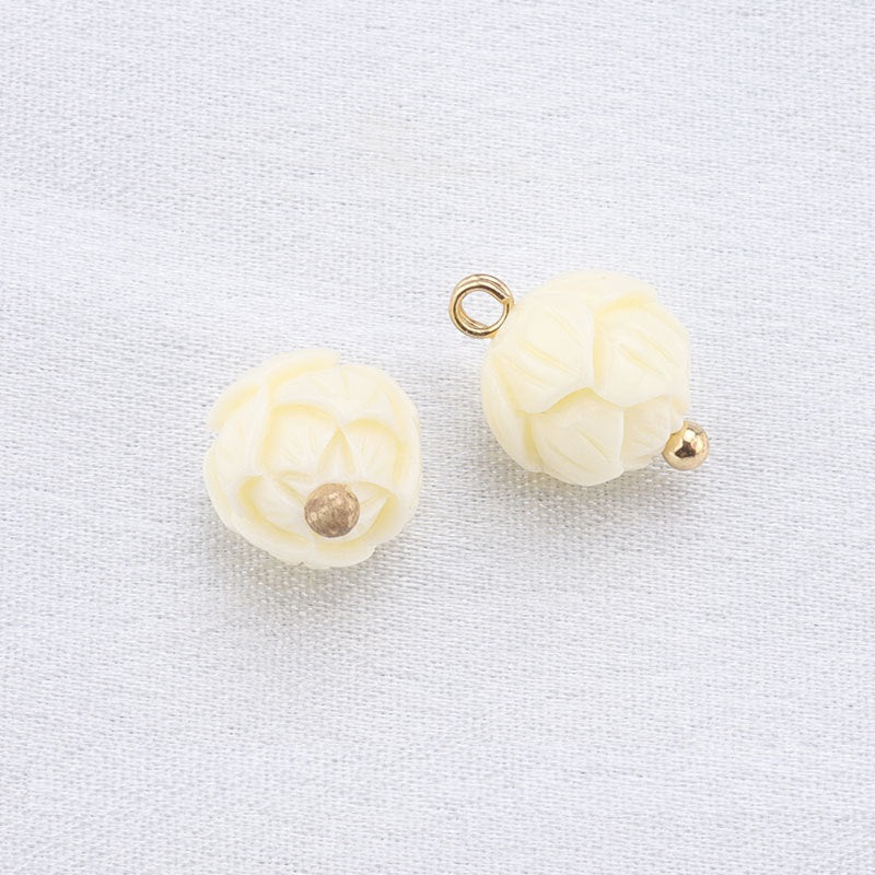Beige flower-motif resin frog buttons with gold loop and small gold stud